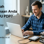 a person doing secure data erasure work on stack of hard drives